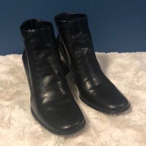 Black boots with stitching detail